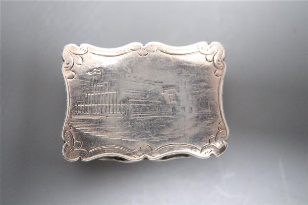 A Victorian silver vinaigrette, by Thomas Dones, engraved with a scene of the Crystal Palace, Birmingham, 1850, 31mm.